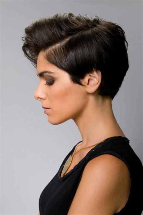 Style short hair - Fluffy Razored Brunette Pixie. The spiky top and side-swept baby bangs give an urban, modern feel to short pixie haircuts. Match your dark brown hair color to your eyebrows to enhance the chic and dramatic flair of your look. The long, angular sideburns are delicate and feminine.